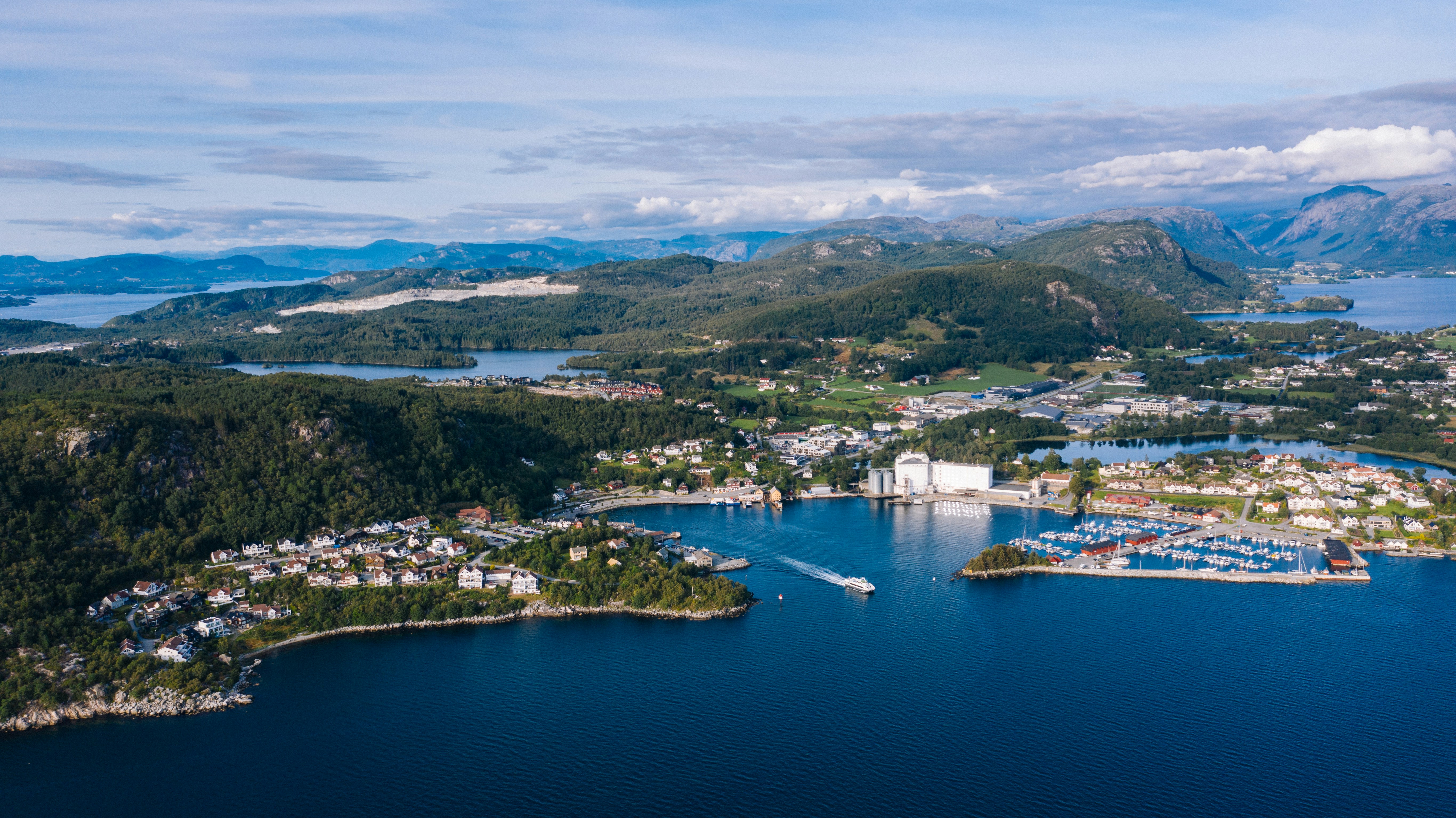 aerial view of city near body of water during daytime