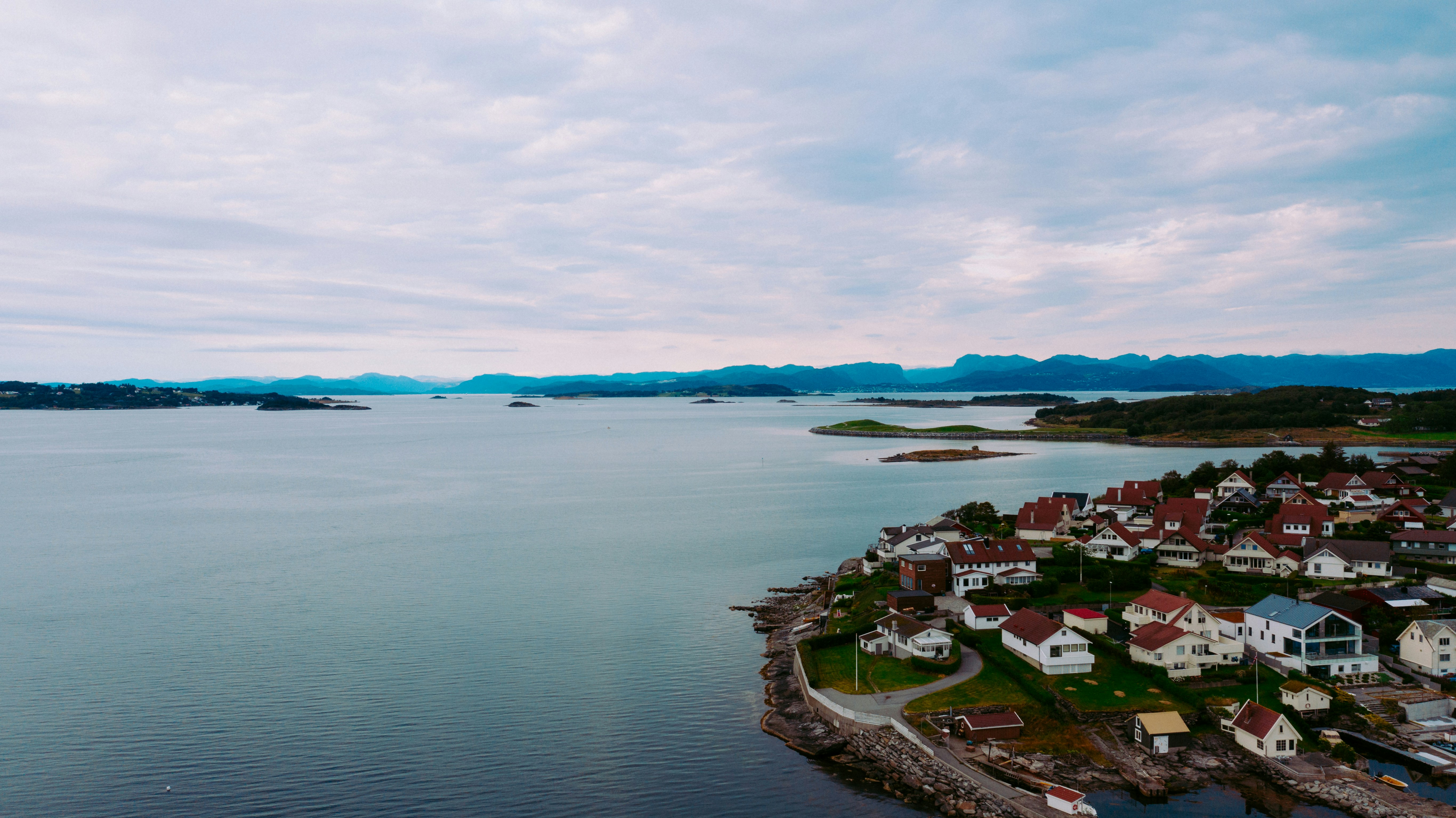 aerial view of city near body of water during daytime