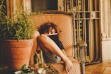 A child reading a colorful storybook in a cozy room.