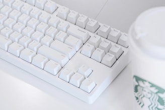white computer keyboard on white table