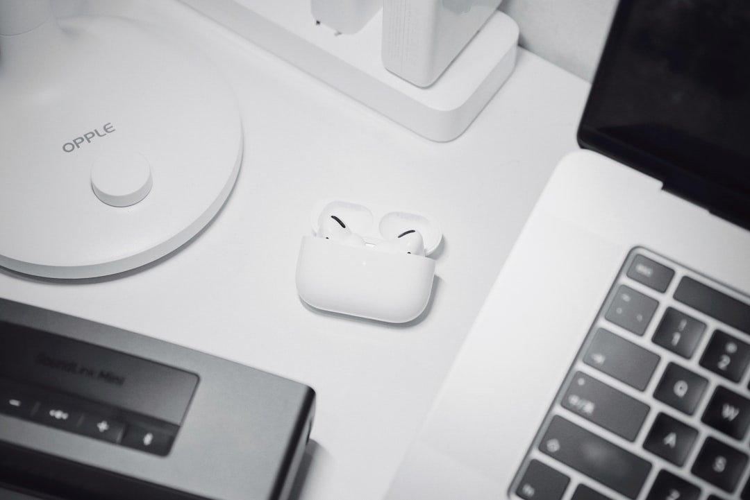 white apple magic mouse on white table