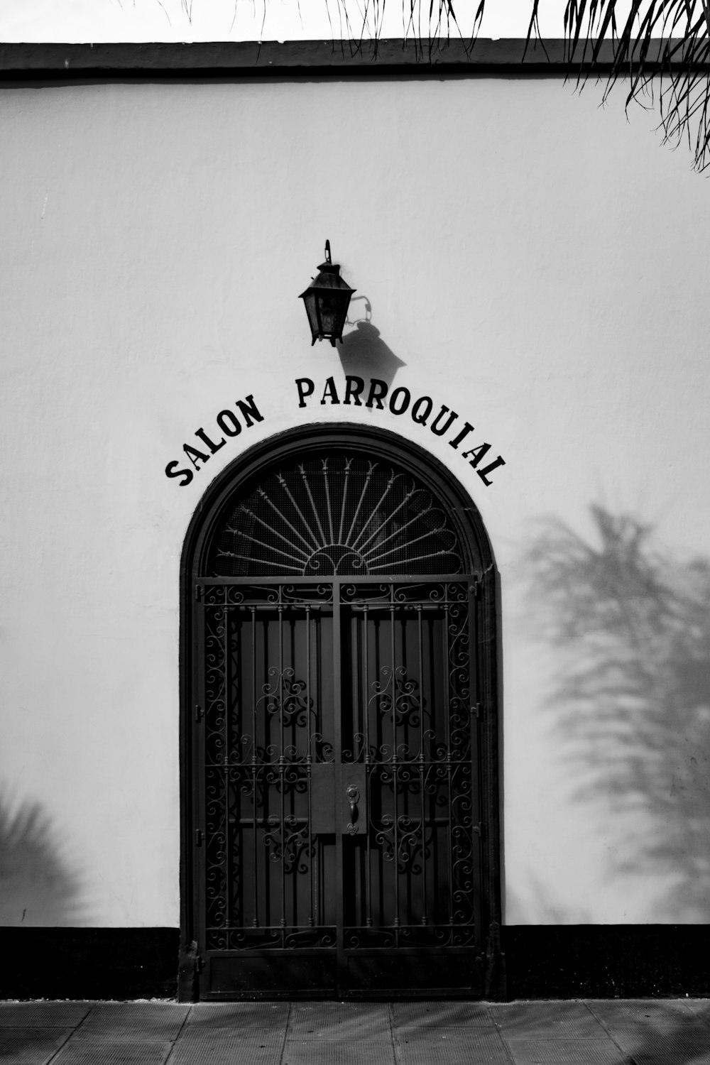 a black and white photo of a salon entrance