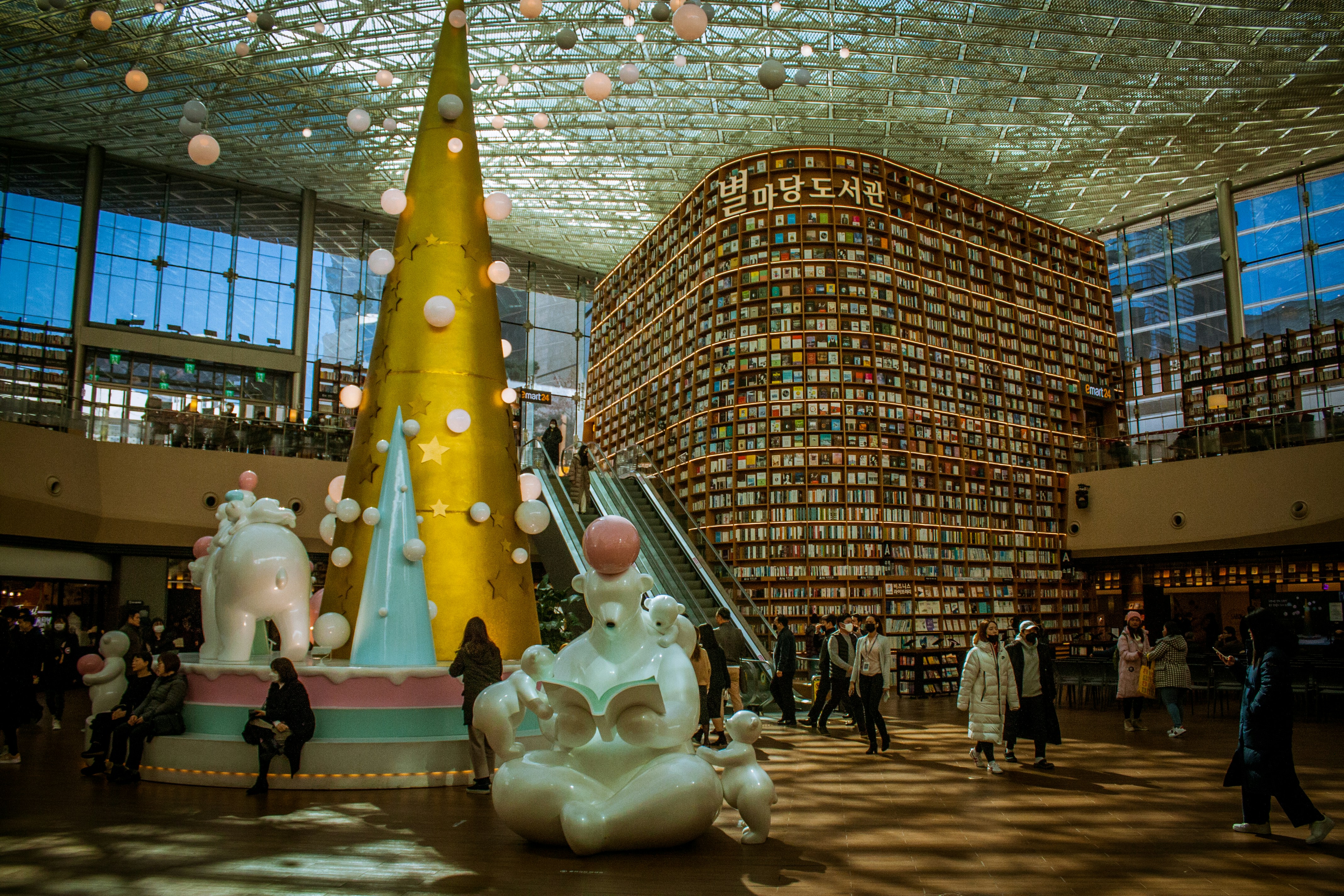 people walking around white and yellow horse statue