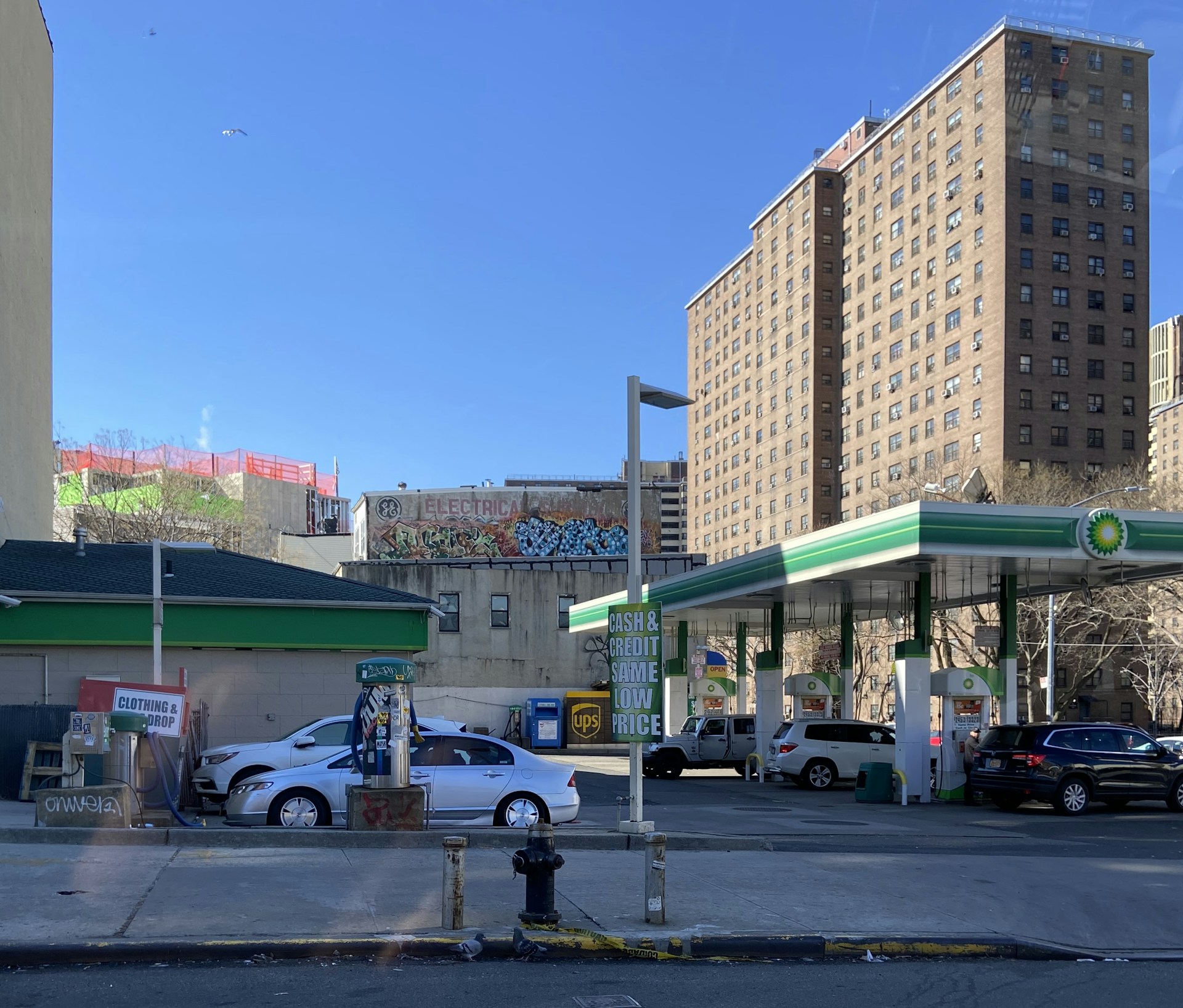 woman wearing yellow long-sleeved dress under white clouds and blue sky during daytime