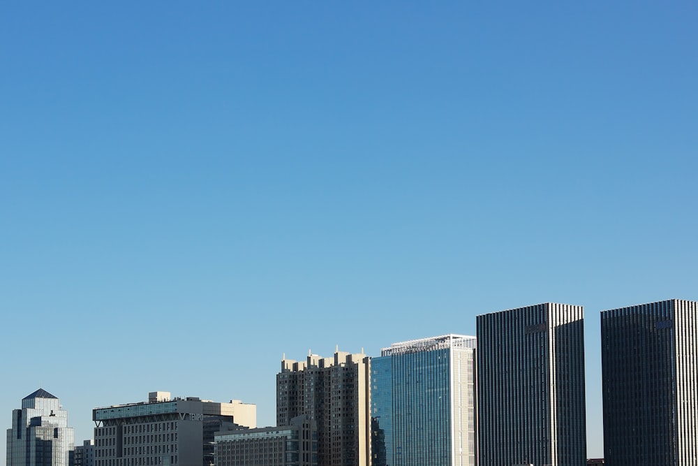 city buildings under blue sky during daytime