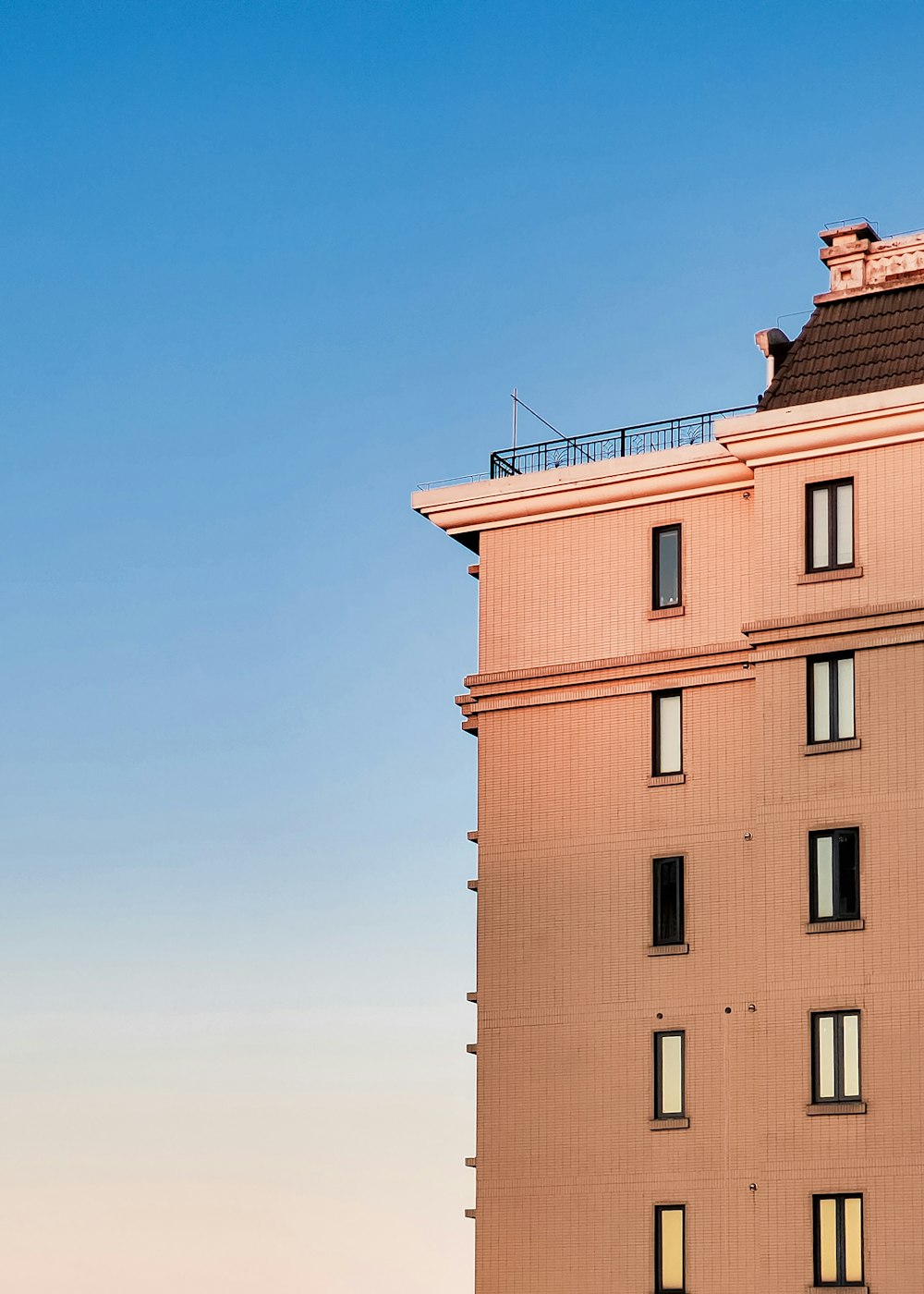 brown concrete building under blue sky during daytime