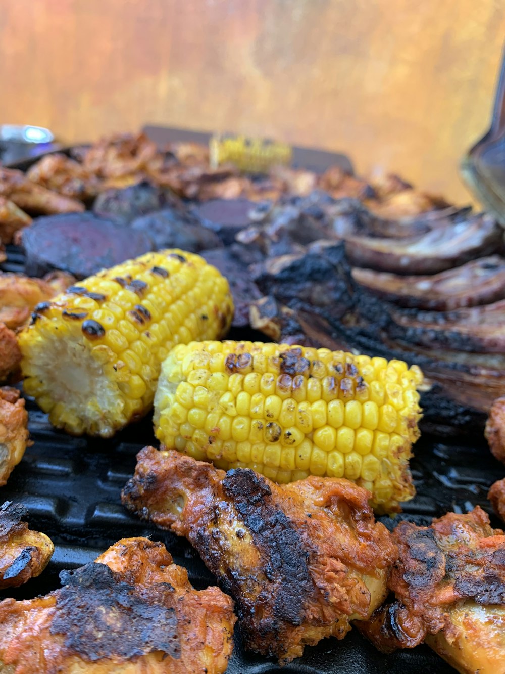 grilled meat with corn on top