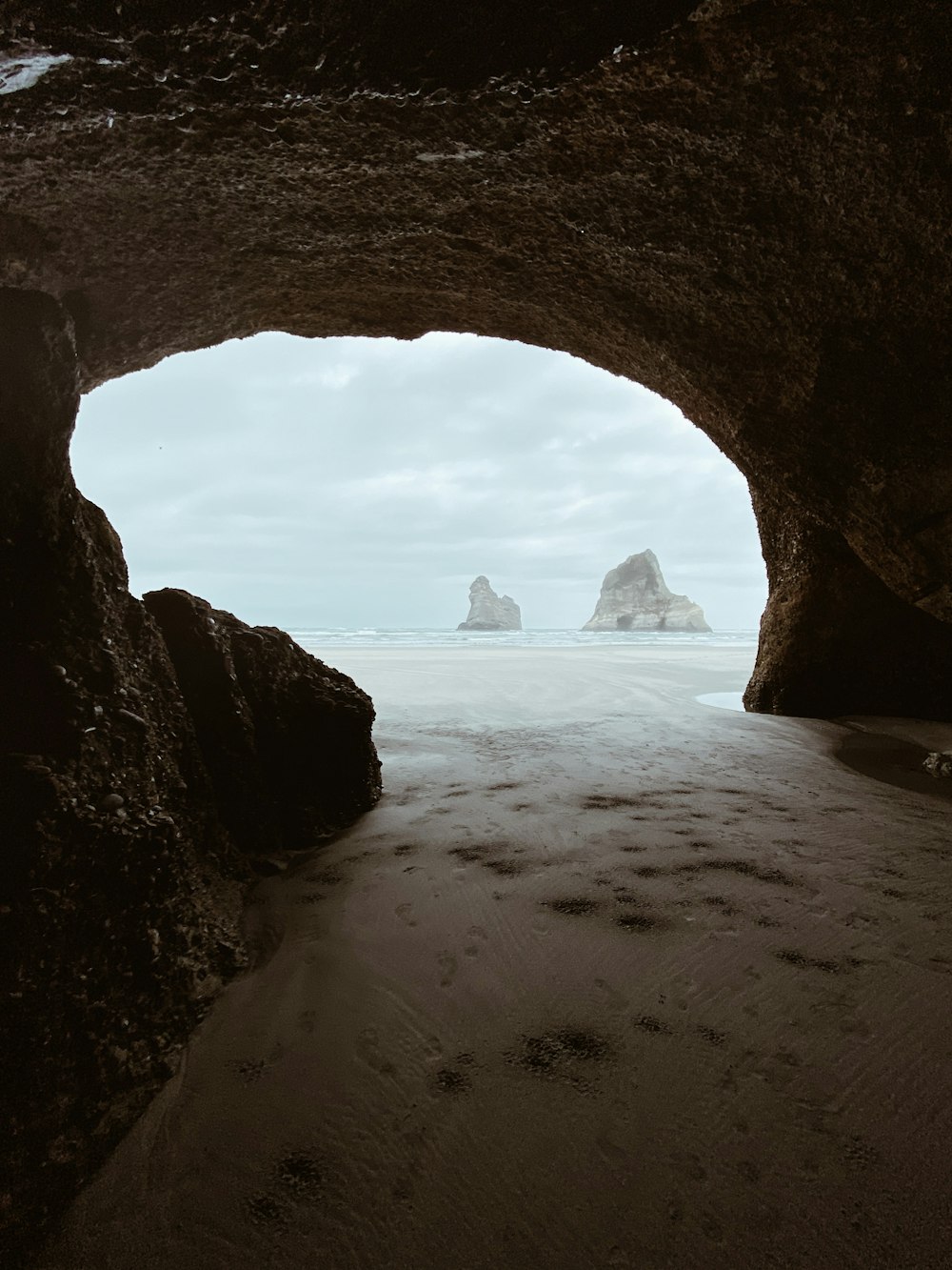 brown rock formation on sea shore during daytime