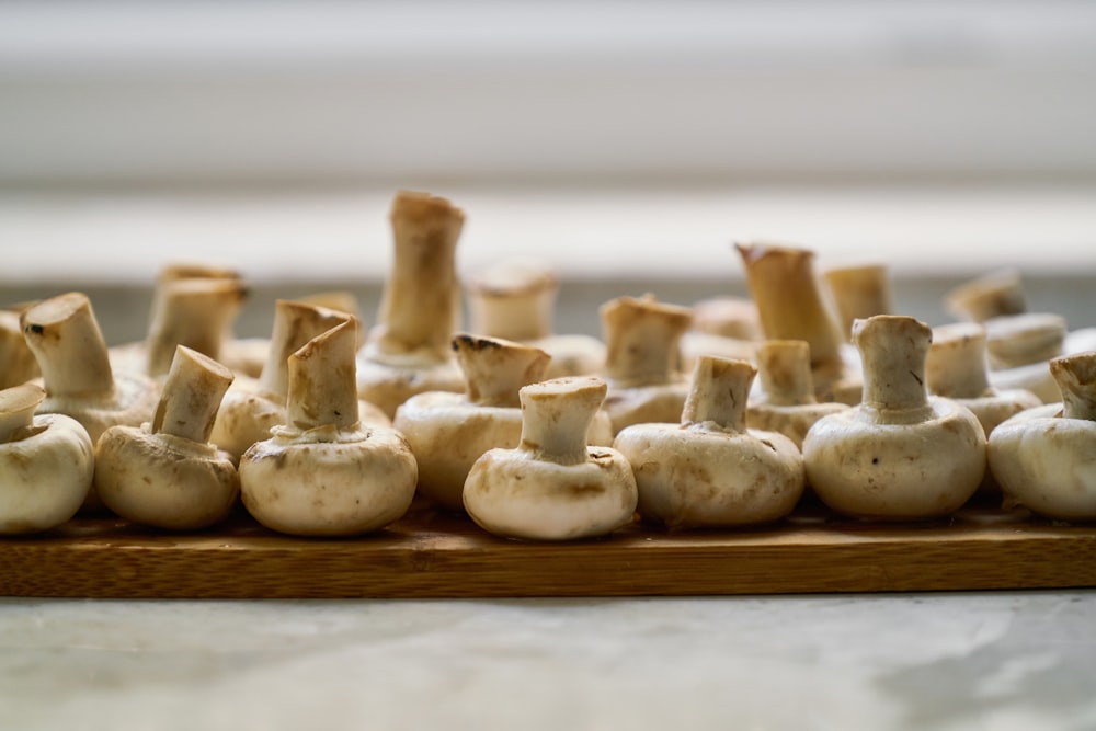 white garlic on brown wooden table