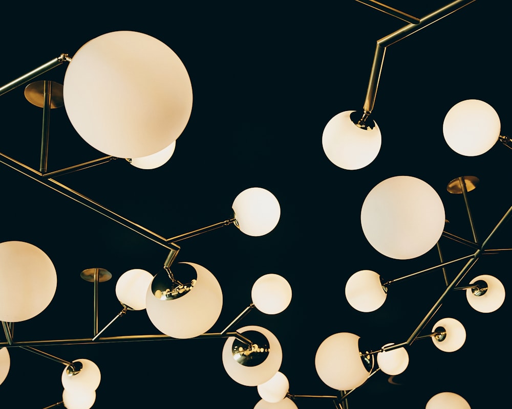 white and black balloons on black background