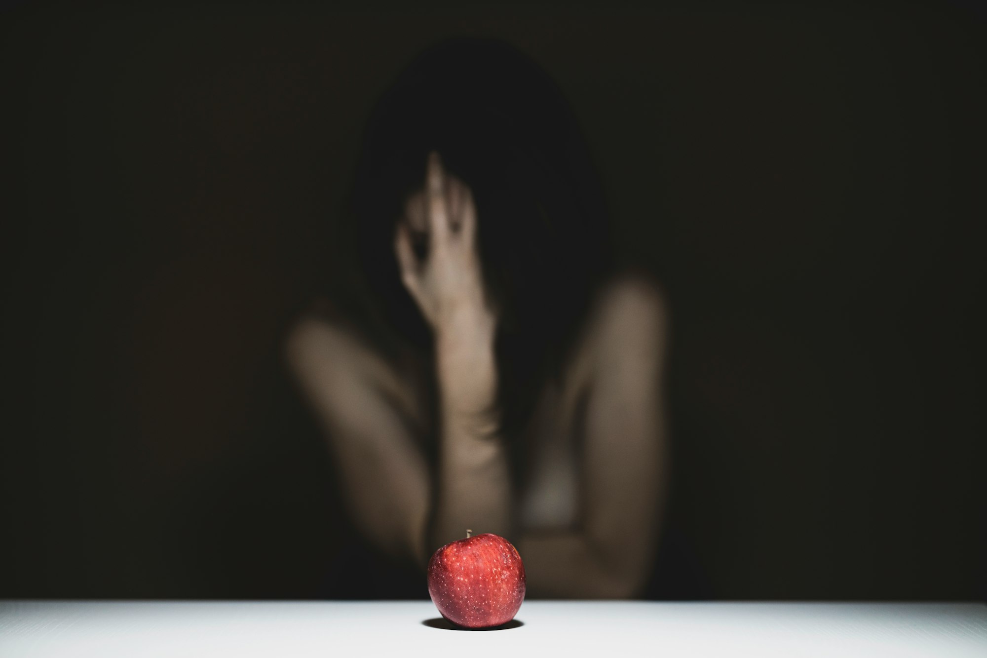 red apple and alone woman