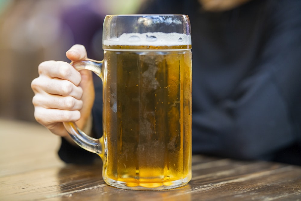 clear glass mug with beer