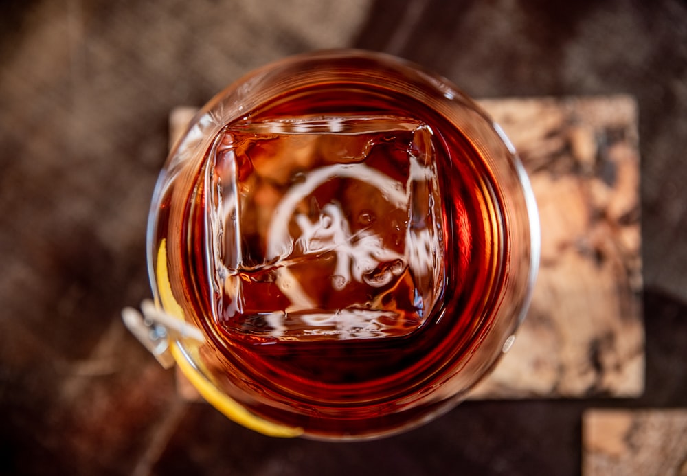 clear glass mug with red liquid