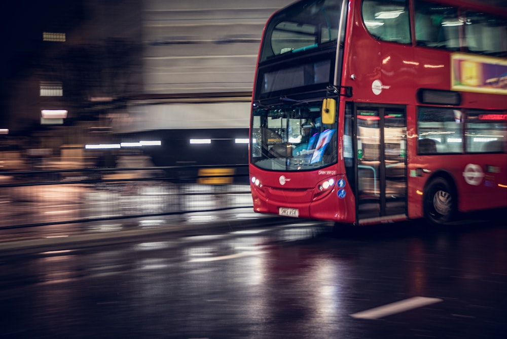 red double decker bus on road