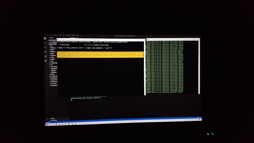 The image features a computer screen displaying a coding environment. The screen shows a text editor with various files and folders listed on the left-hand side, while the main coding area is open with a command line interface. There are green text outputs typical of command line operations performed on a black background.