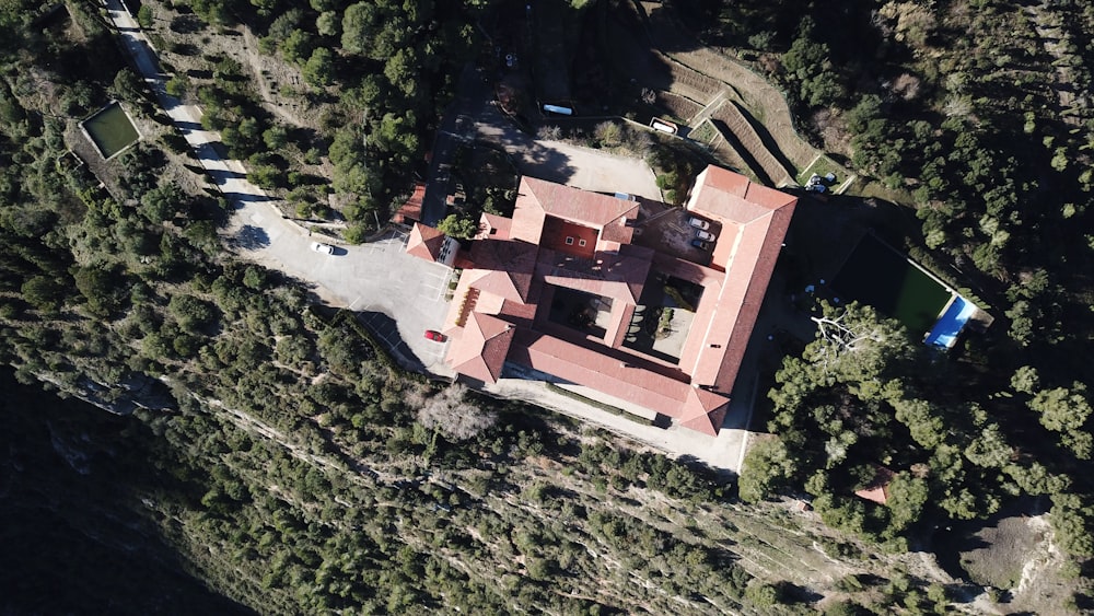 aerial view of brown concrete building on hill
