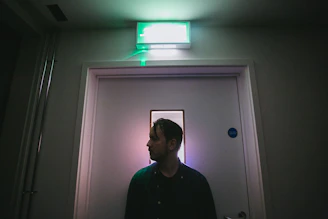 A crisp photo of emergency lighting seamlessly installed above an office exit door.