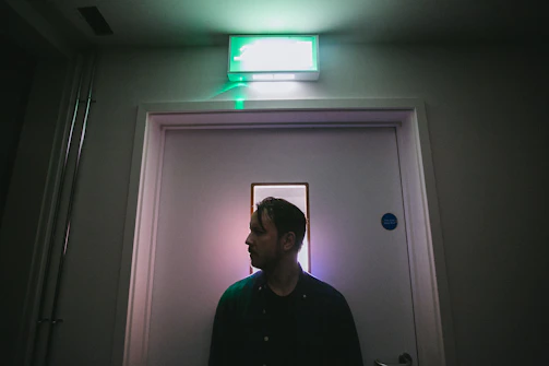 A crisp photo of emergency lighting seamlessly installed above an office exit door.