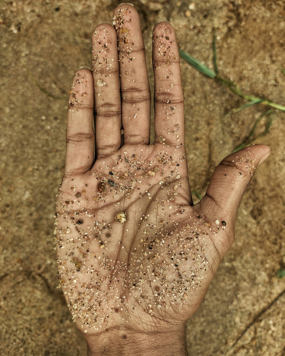 persons hand with water droplets