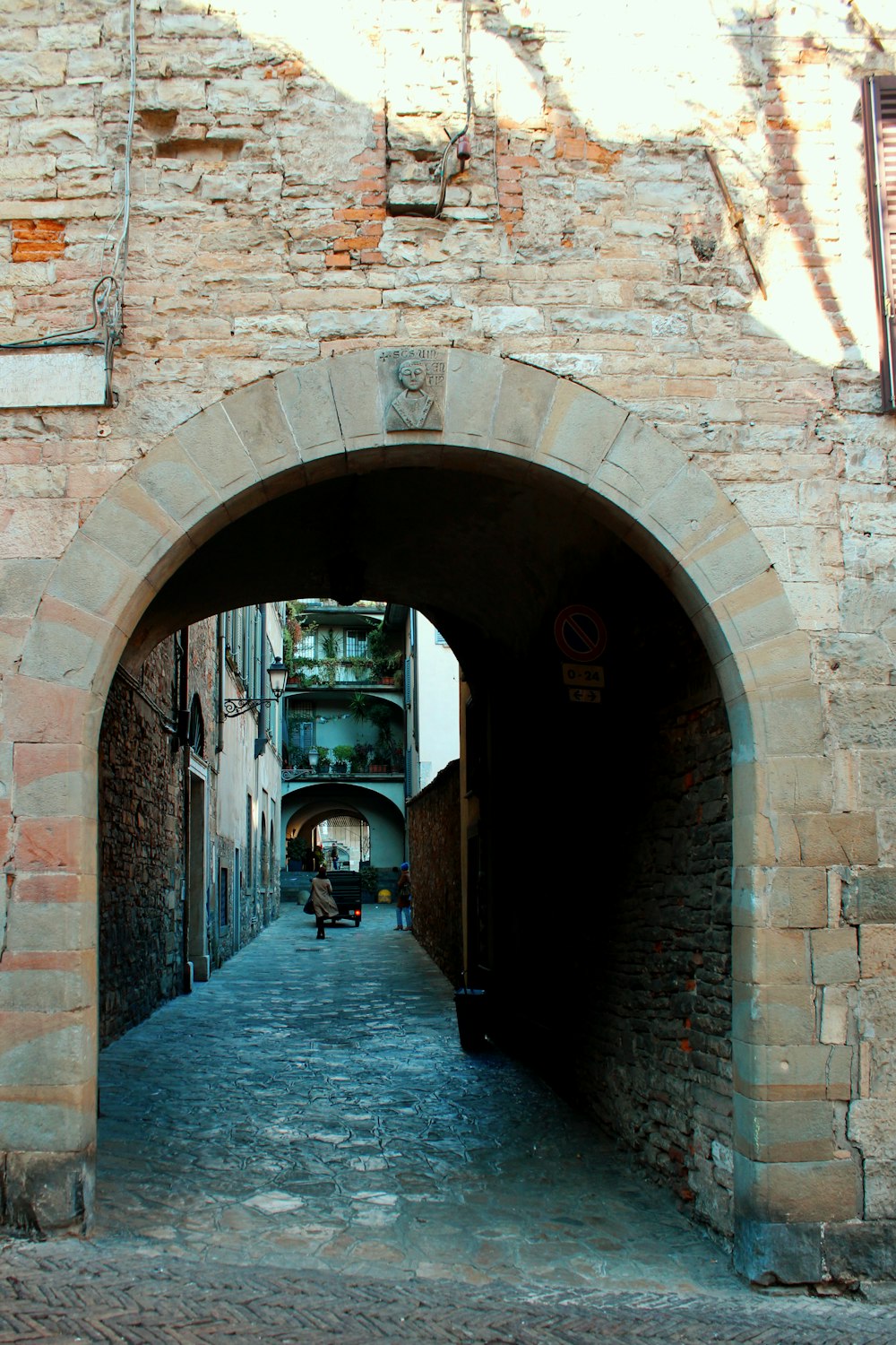 brown brick arch with arch gate