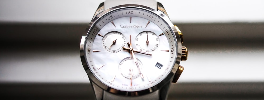 silver and white chronograph watch