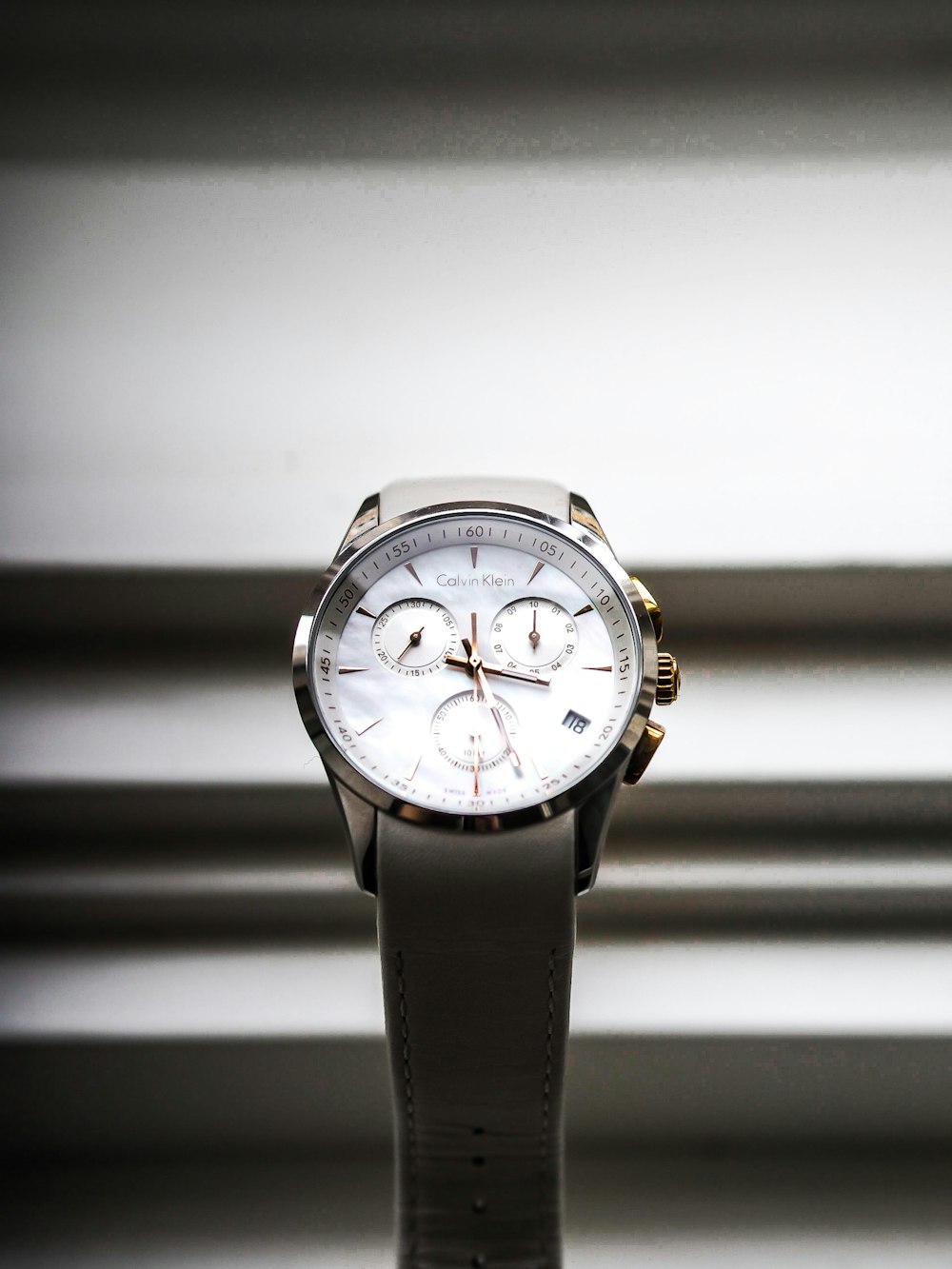 black leather strap white chronograph watch