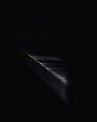Minimalist piano keys fading into a misty, reverberant soundscape.