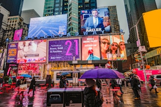 woman in black leather jacket holding pink umbrella