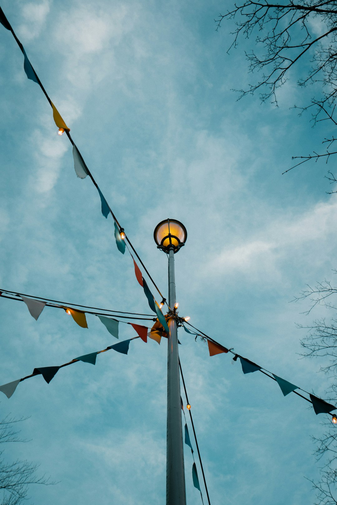 yellow and black lantern on blue sky during daytime