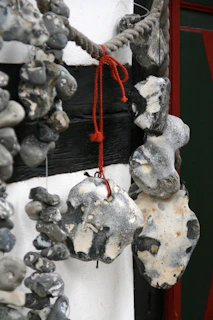 Polish flint stones arranged artistically on a wooden surface with soft natural light.