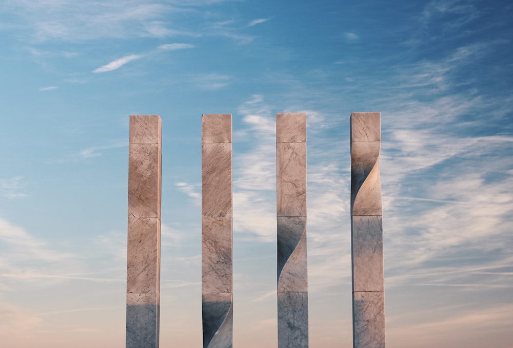 brown wooden poles under blue sky during daytime