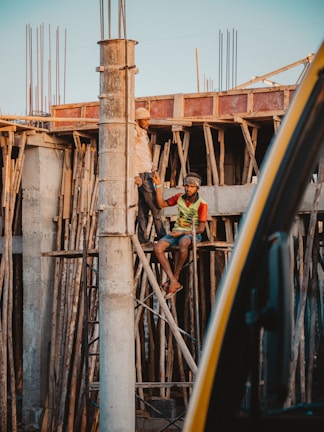 Construction workers collaborating on a building site.