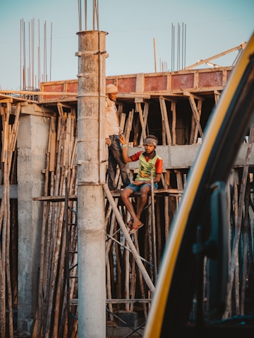Construction workers collaborating on a sustainable building site