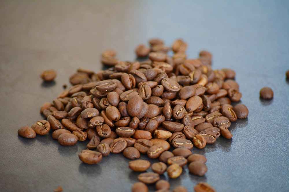 brown coffee beans on blue textile