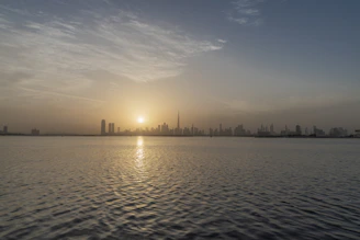 A calm sunrise over a city skyline symbolizing steady and growing investment opportunities.