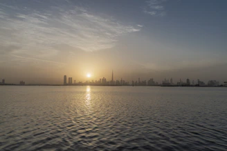 A serene sunrise over a calm city skyline symbolizing new beginnings and hope