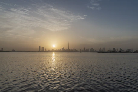 A bright sunrise over a city skyline symbolizing new beginnings and upcoming opportunities.