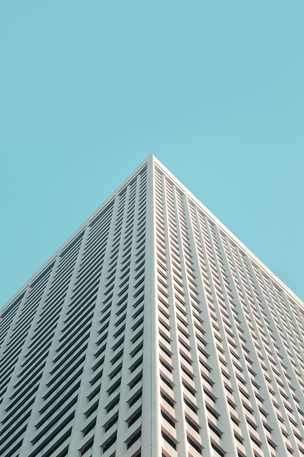 white concrete building under blue sky during daytime