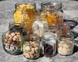 clear glass jars with white and brown stones