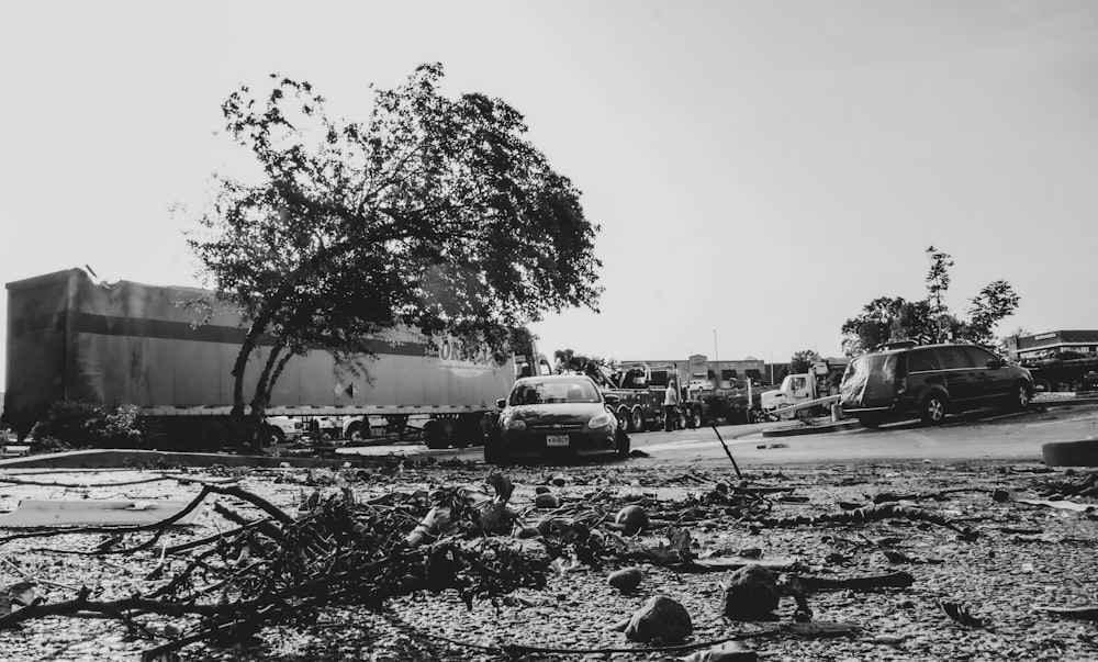 grayscale photo of cars on road