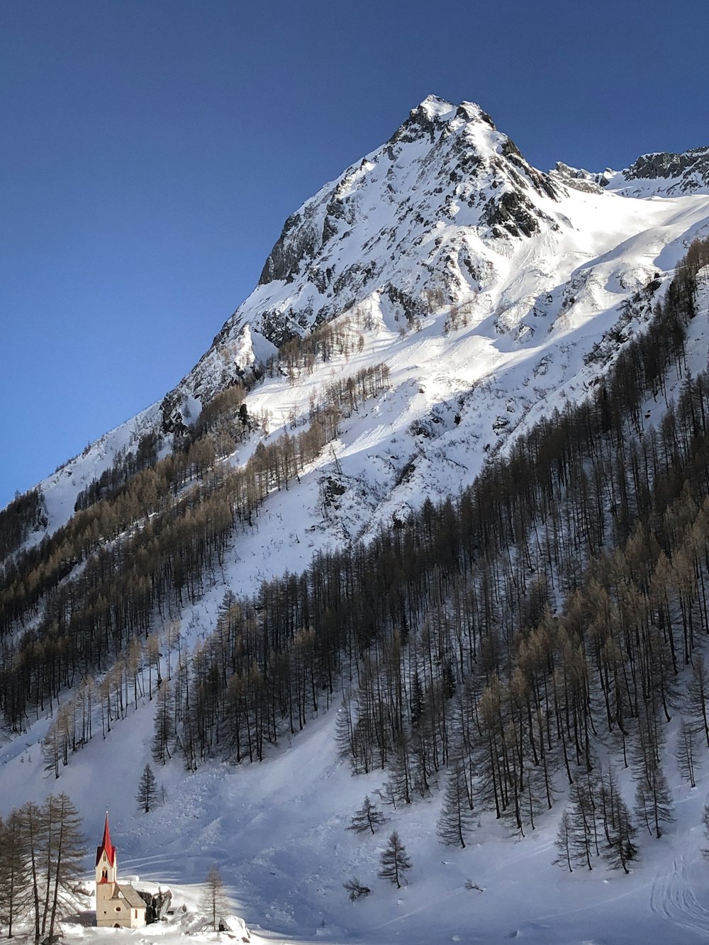 snow covered mountain during daytime