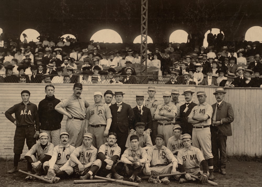 grayscale photo of men sitting on bench