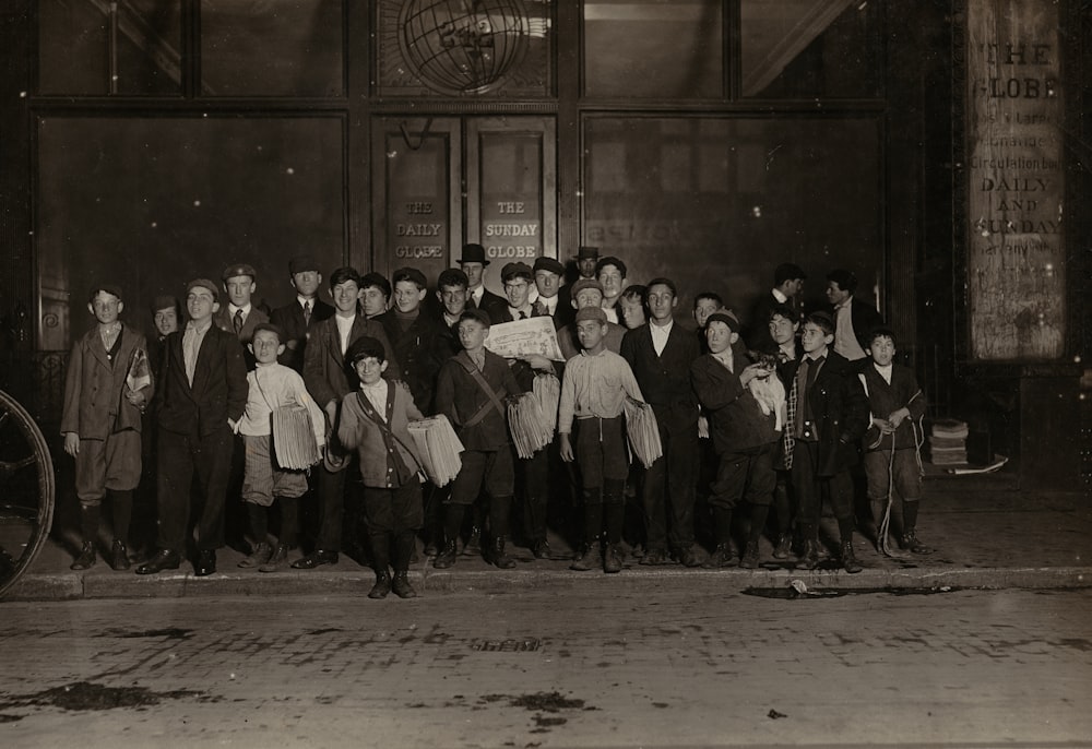 group of people standing on gray concrete floor