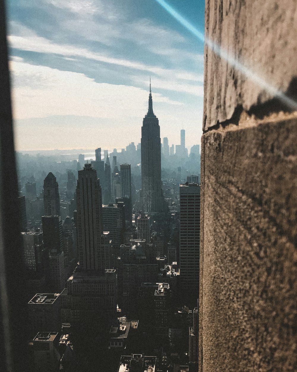 city skyline under blue sky during daytime