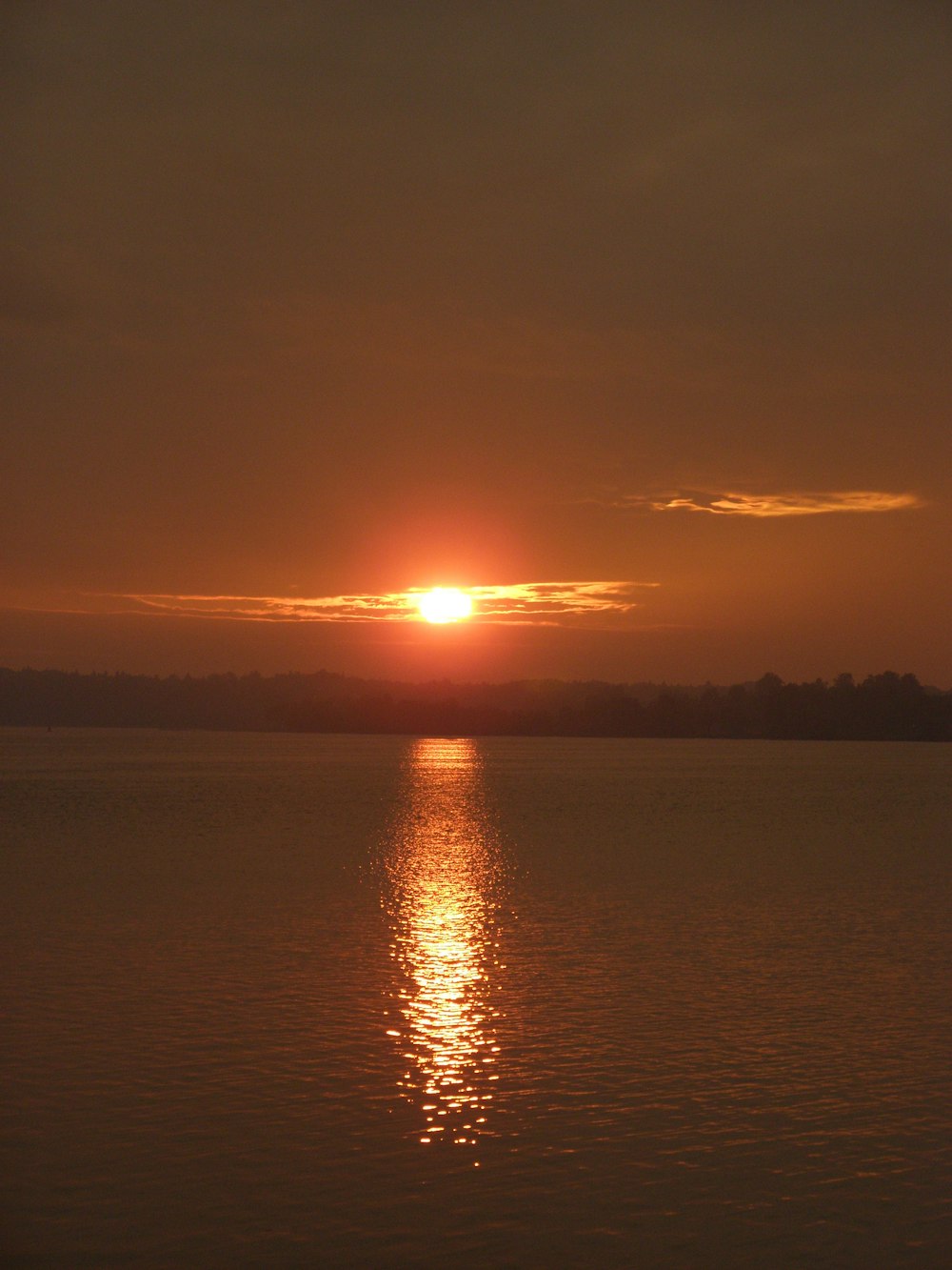 body of water during sunset