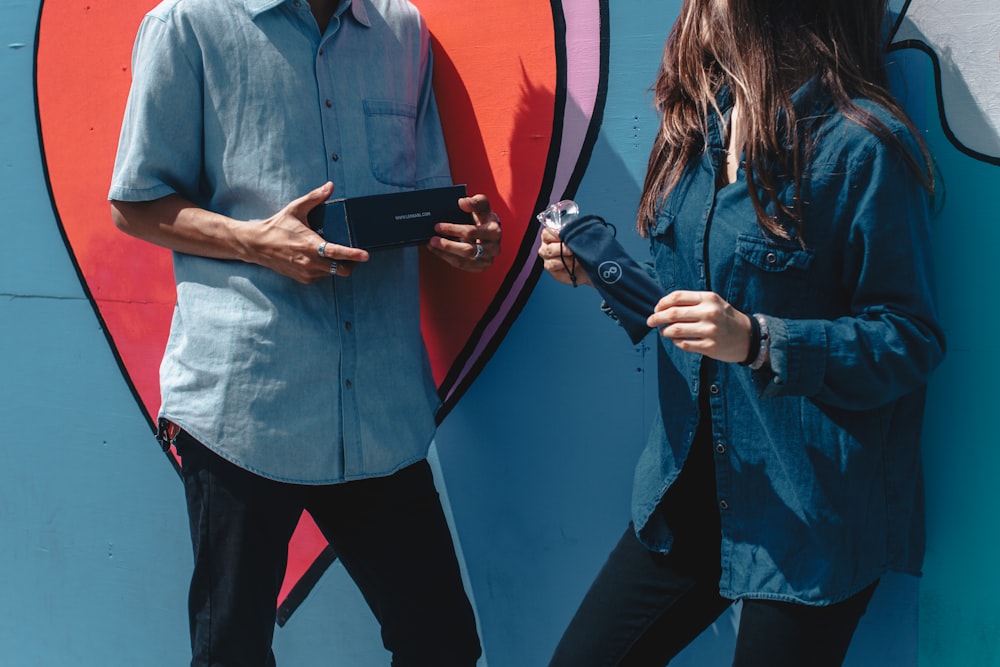 man in blue button up shirt and blue pants