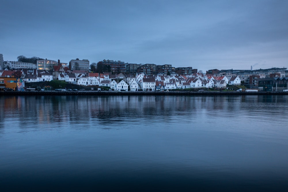 city buildings near body of water during daytime