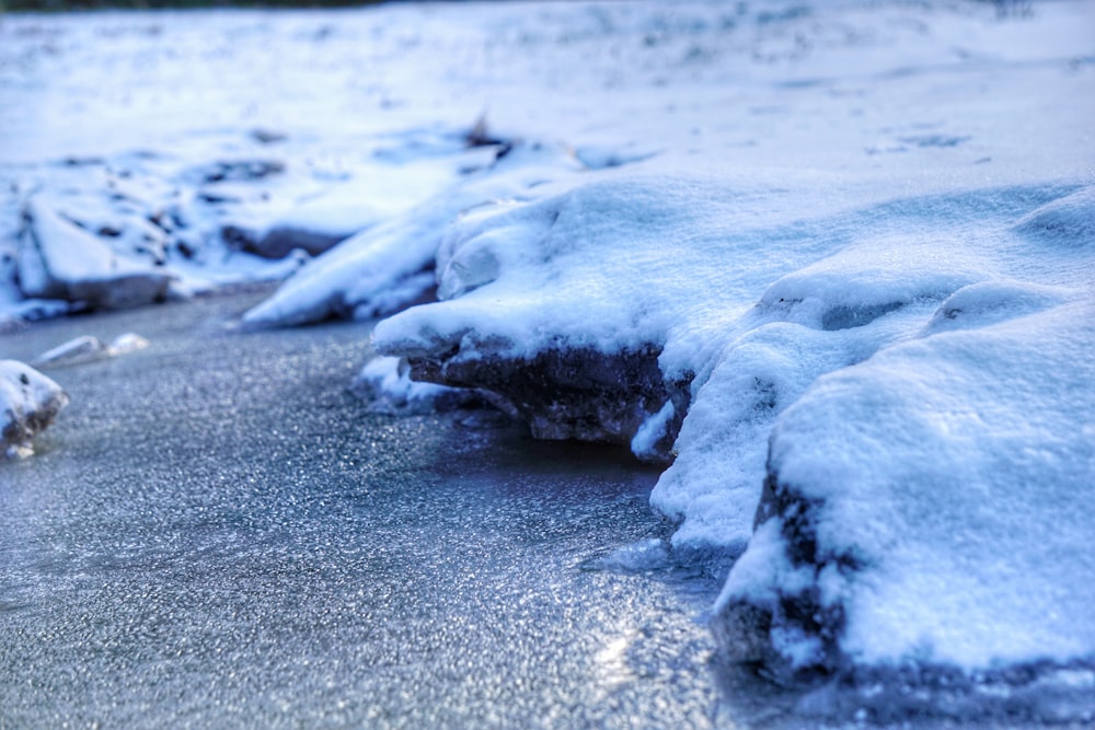 white ice on gray sand