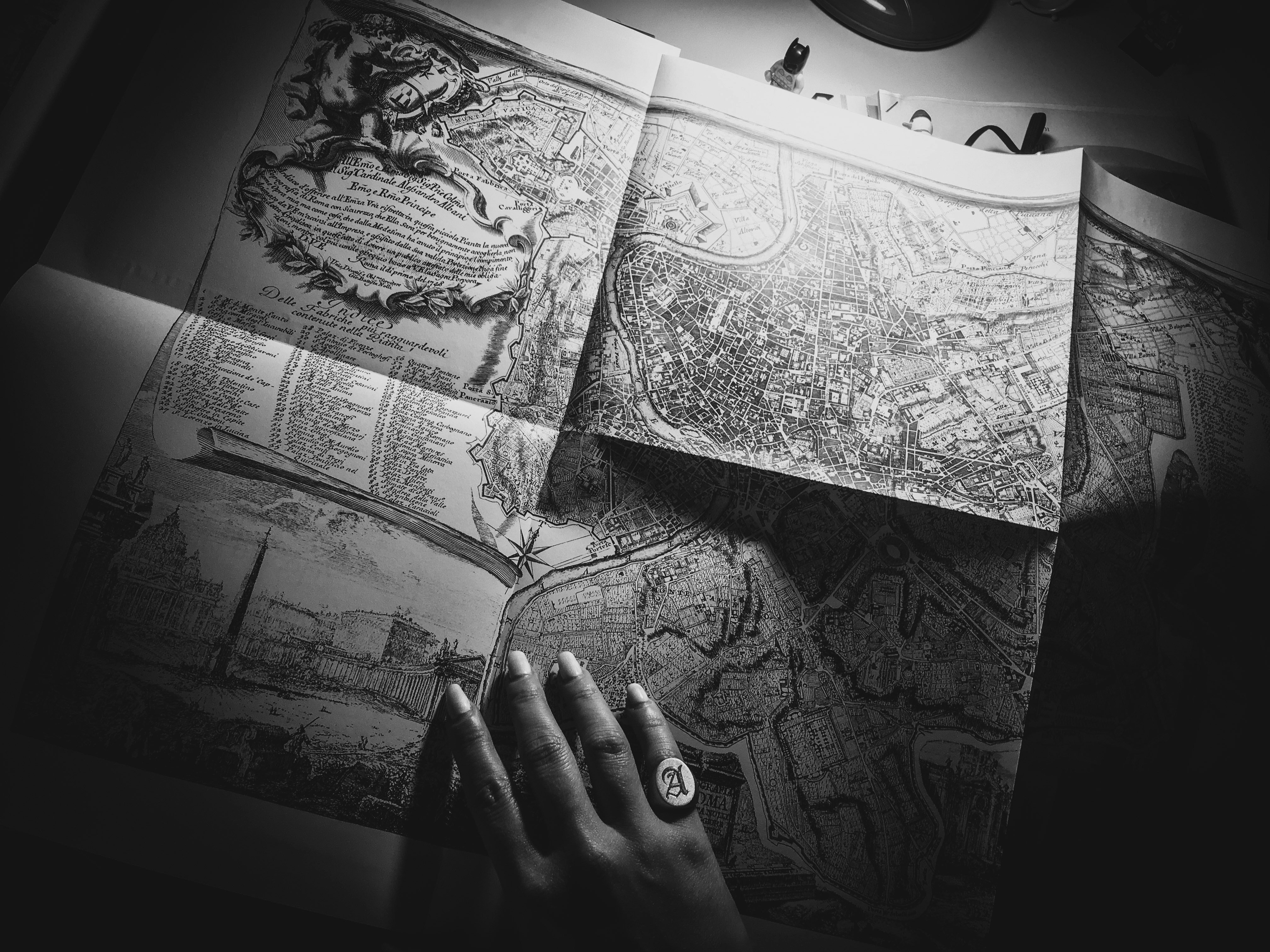 person holding black and white sketch