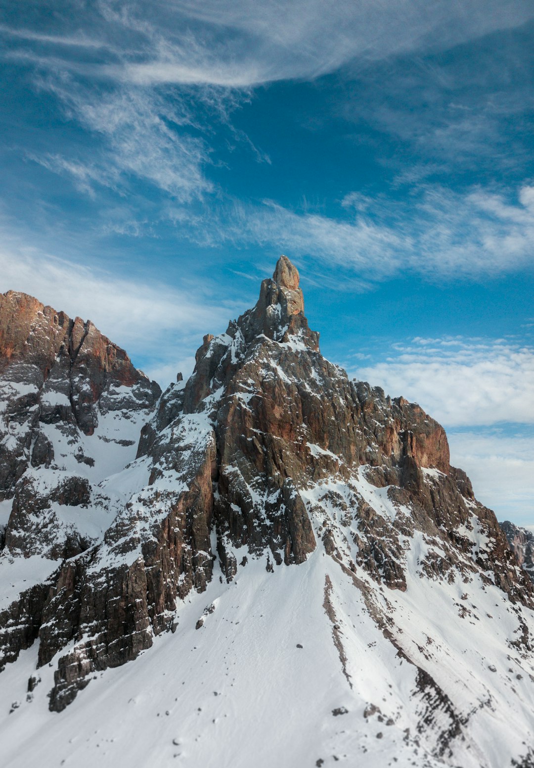 snow covered mountain under blue sky during daytime